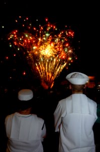 Sailors aboard USS Essex (LHD-2) watching fireworks in Cairns 090704-N-0977D-078