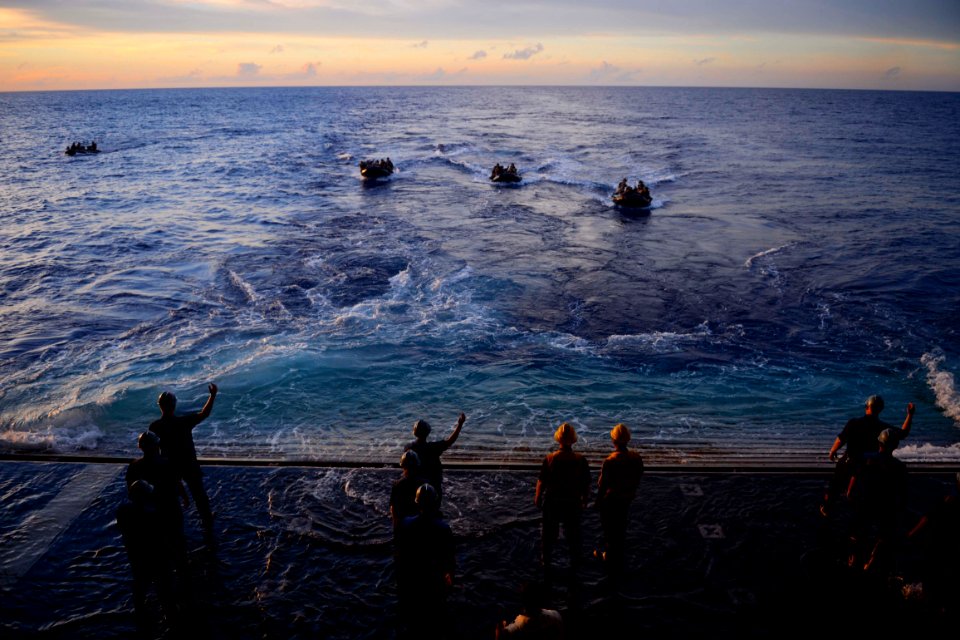 Sailors aboard USS Green Bay help Marines during a training exercise. (18718398606)