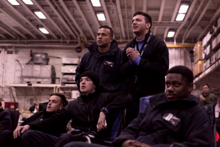 Sailors and Marines watch a screening of the Super Bowl in the hangar bay of amphibious assault ship USS Bonhomme Richard (LHD 6) (32369347580)