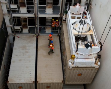 Sailors assist with crane operations onboard USNS Maj. Bernard F. Fisher at Naval Base Guam. (28890617760)