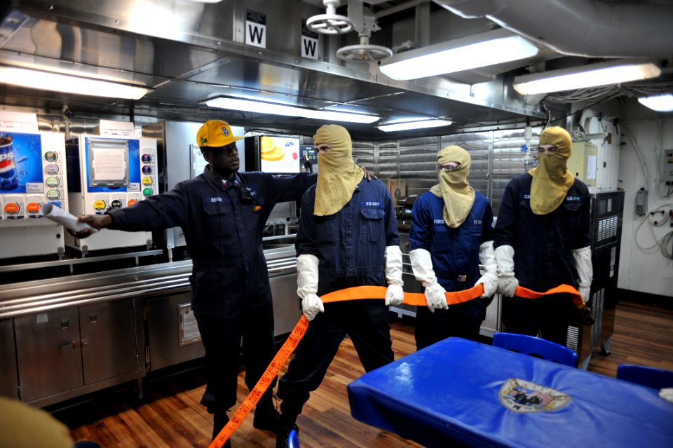 Sailors lean fire fighting procedures at sea. (8426060401)