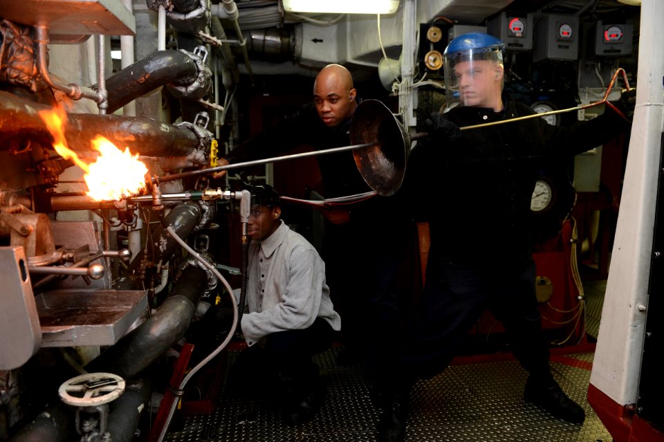 Sailors light the boiler aboard USS Bonhomme Richard. (13544565885)