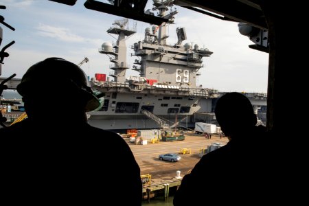 Sailors look at USS Dwight D. Eisenhower as USS Bataan departs on a deployment (32824548290)