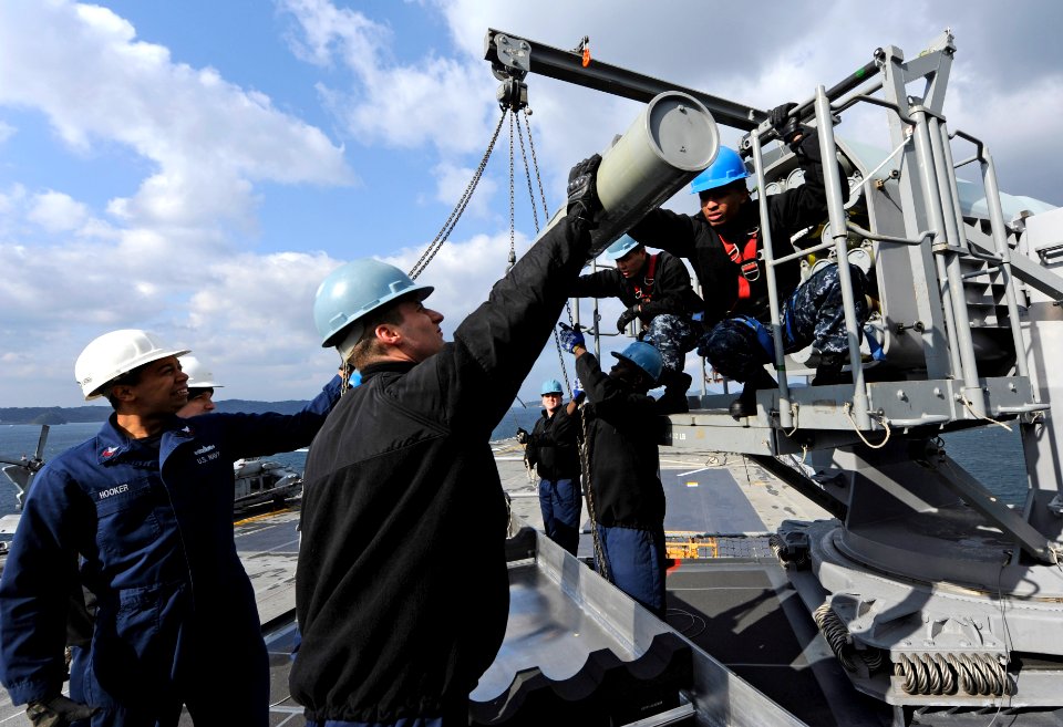 Sailors move a missile into storage. (8413081345)