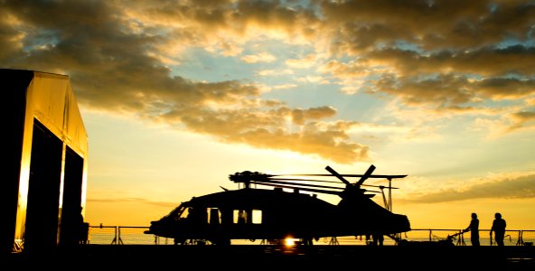 Sailors move an MH-60S helicopter into the hangar aboard hospital ship USNS Mercy. (26951193543)