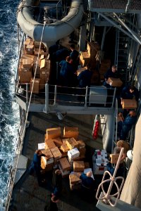 Sailors move supplies aboard USS Mobile Bay. (8498334596)
