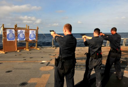 Sailors fire small arms on USS Underwood 121005-N-ZE938-004