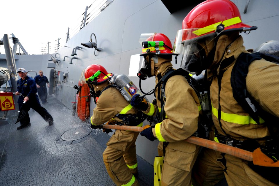 Sailors practice firefighting at sea. (8202180991)
