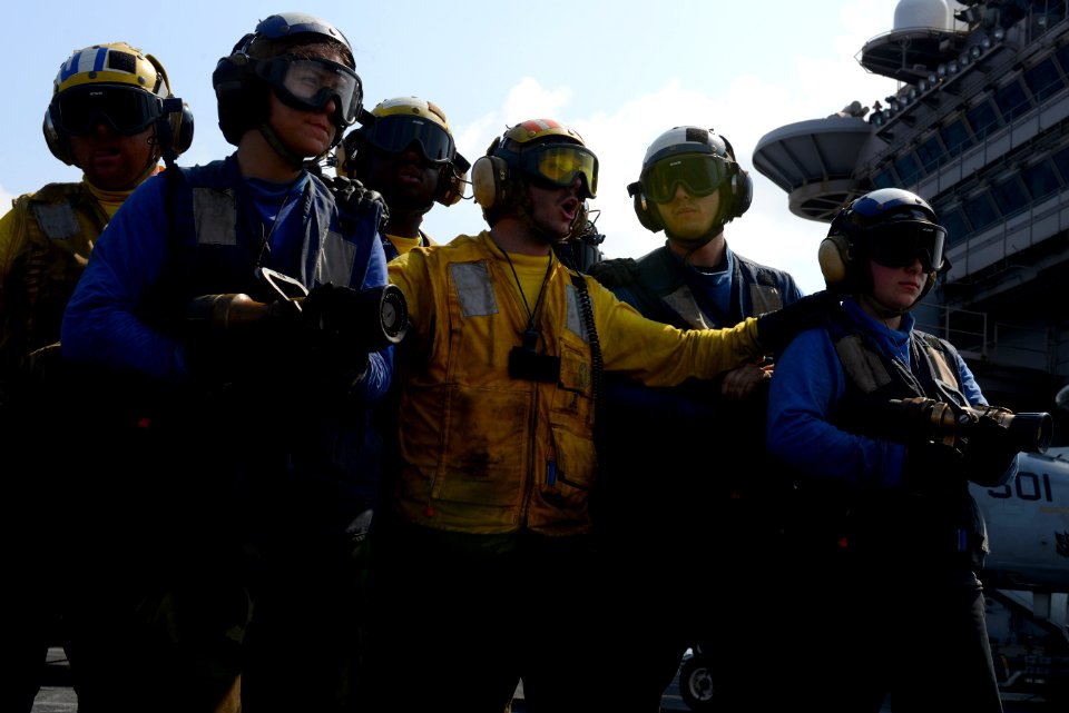 Sailors practice firefighting at sea. (8599729921)