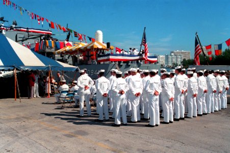 Sailors from USS Pharris (FF-1094) standing at parade rest during change of command ceremony Fort Lauderdale Navy Appreciation Week 1989 DN-SC-90-01842