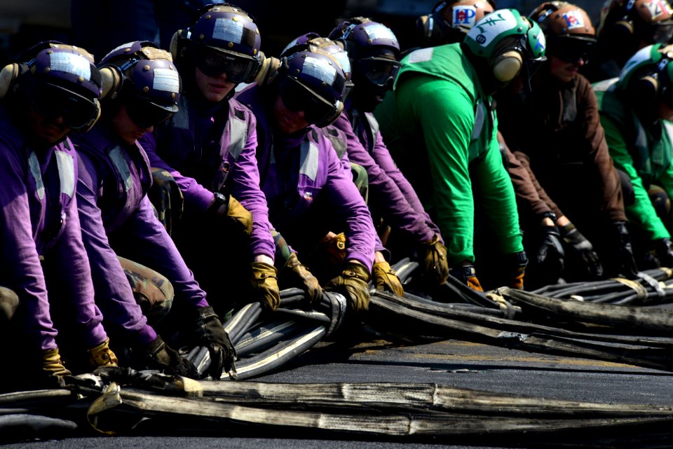 Sailors prepare an emergency barricade during a drill. (8599729665)
