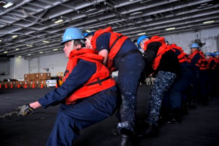 Sailors heave on a phone-and-distance line. (8202197051)