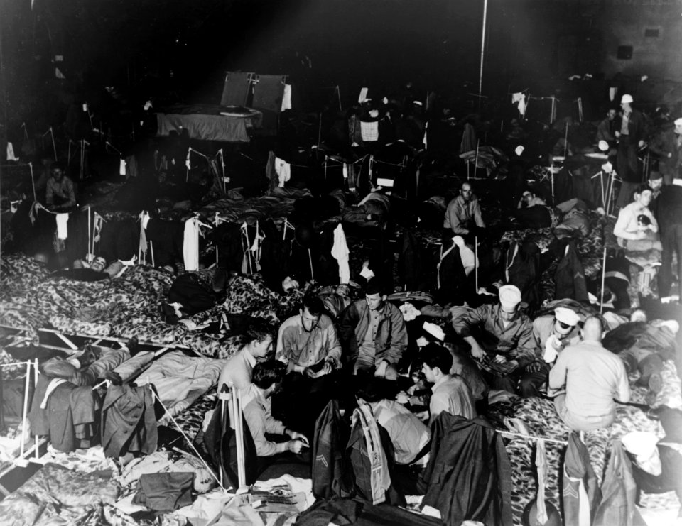 Sailors in hangar of USS San Jacinto (CVL-30) in April 1944