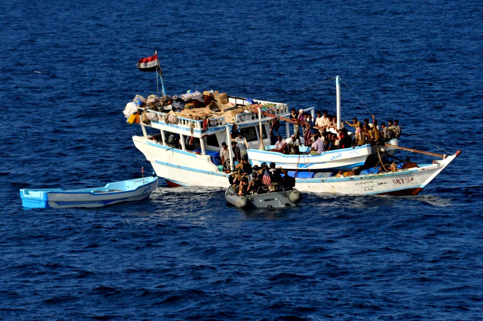 Sailors investigate a dhow. (8205133845)