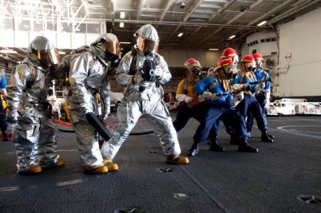 Sailors learn how to man a fire hose. (8560368770)
