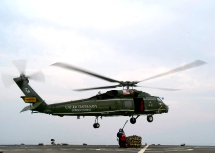 Sailors load helicopter during resupply DVIDS99310