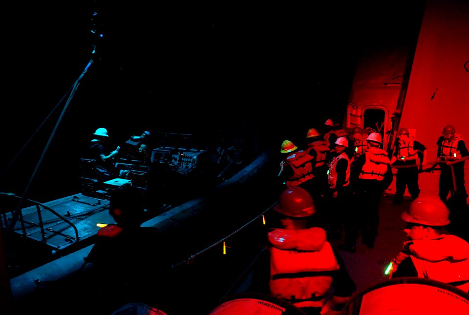 Sailors lower a RHIB during training. (8233127184)