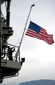 Sailors lower the American flag aboard USS Bonhomme Richard. (8413081809)