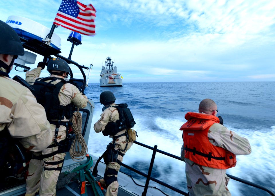 Sailors ride a RHIB for a VBSS exercise. (8468328522)
