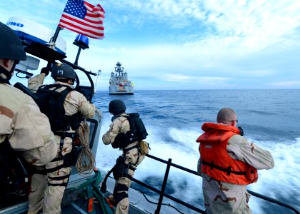 Sailors ride a RHIB for a VBSS exercise. (8468328522)