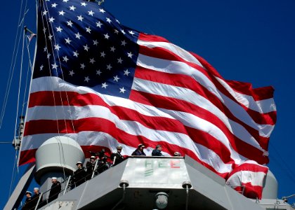 Sailors man the rails as the guided-missile destroyer USS Donald Cook (4380131772)