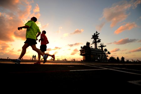 Sailors run on flight deck of USS George H.W. Bush. (8693197474) photo