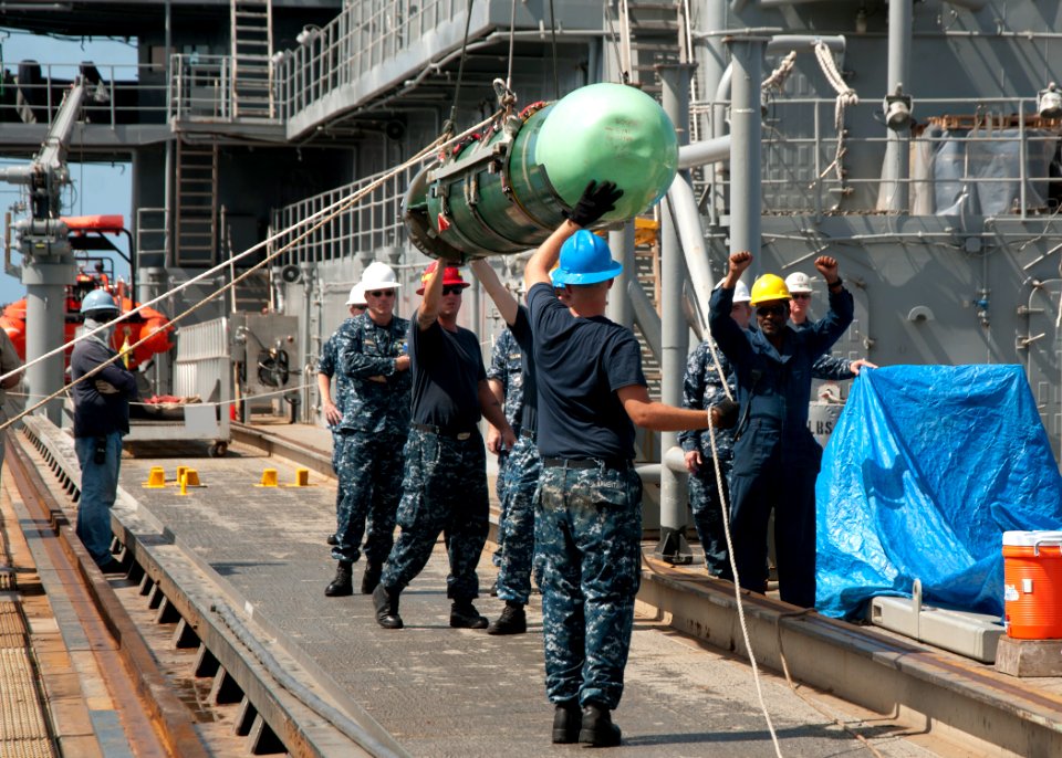 Sailors move a torpedo. (8199141341)