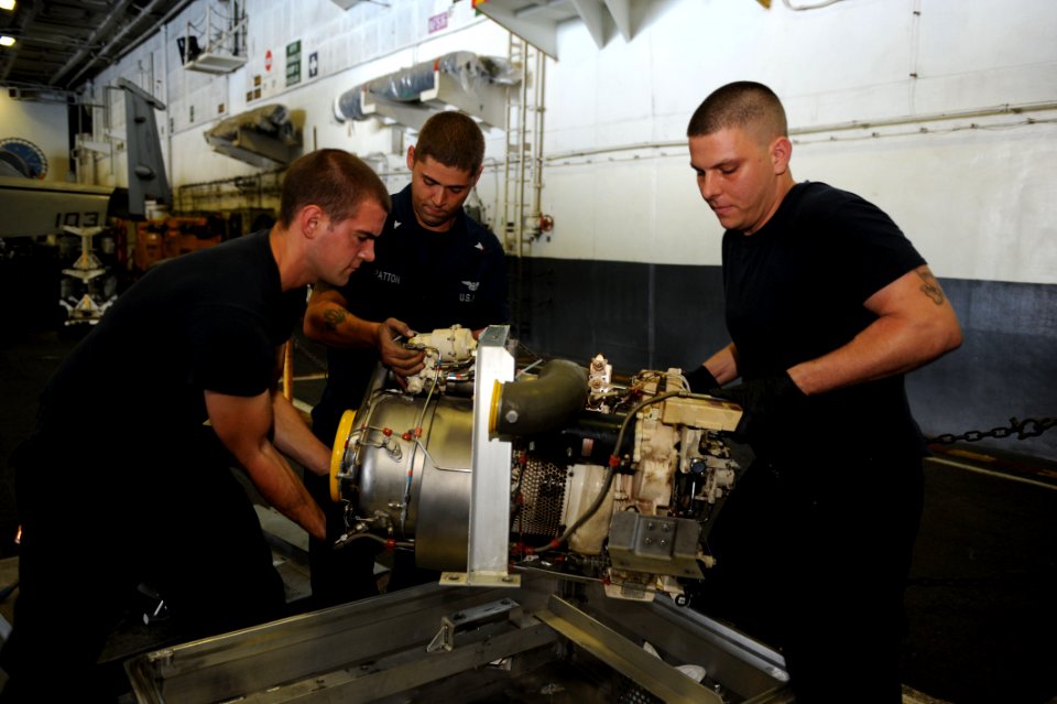 Sailors move equipment aboard USS Dwight D. Eisenhower. (8229184651)