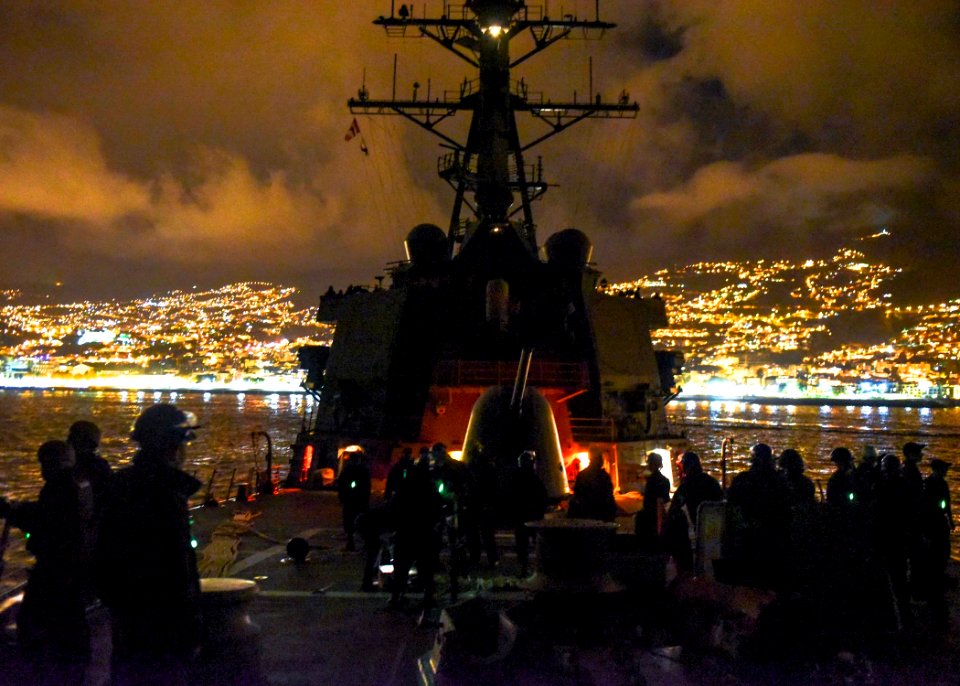 Sailors stand sea and anchor detail and security watches USS Mahan as they depart Funchal. (31152053512)