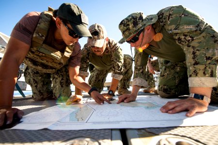 Sailors train to use a chart and compass to plot their location. (38039914011) photo