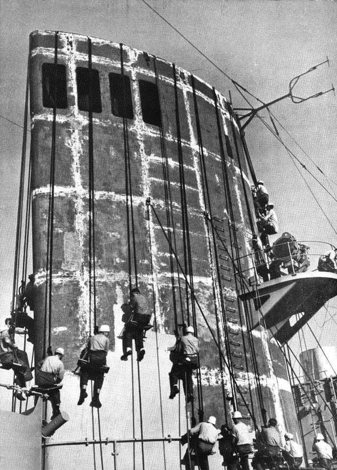 Sailors paint stack of USS General J.C. Breckinridge (AP-176) c1949