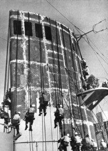 Sailors paint stack of USS General J.C. Breckinridge (AP-176) c1949