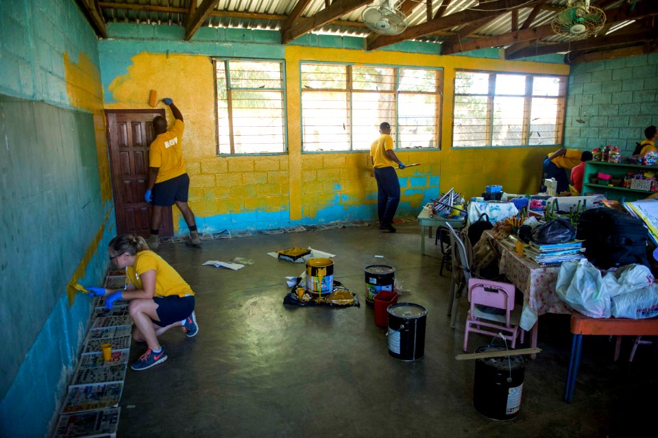 Sailors paint the walls of a Honduran elementary school 170302-N-YL073-007