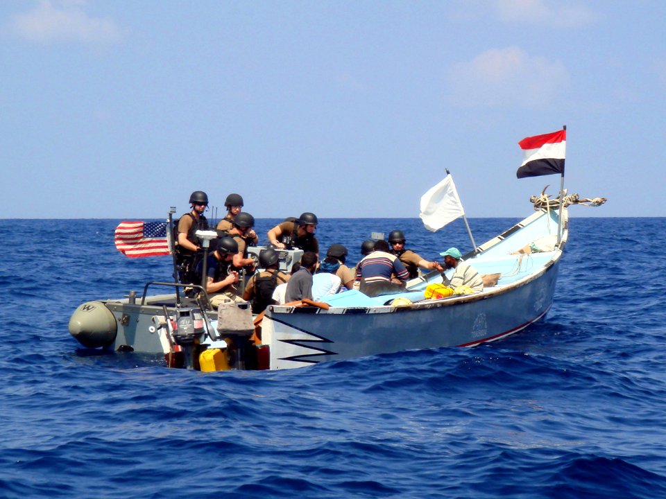 Sailors visit a Yemeni fishing boat. (8189829861)