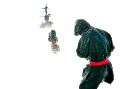 Sailors participate in a flight deck washdown at sea. (8446976315)