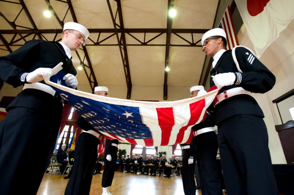 Sailors perform a flag folding ceremony. (8199139133)