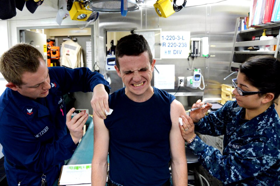 Sailors provide immunizations at sea. (8574828572)