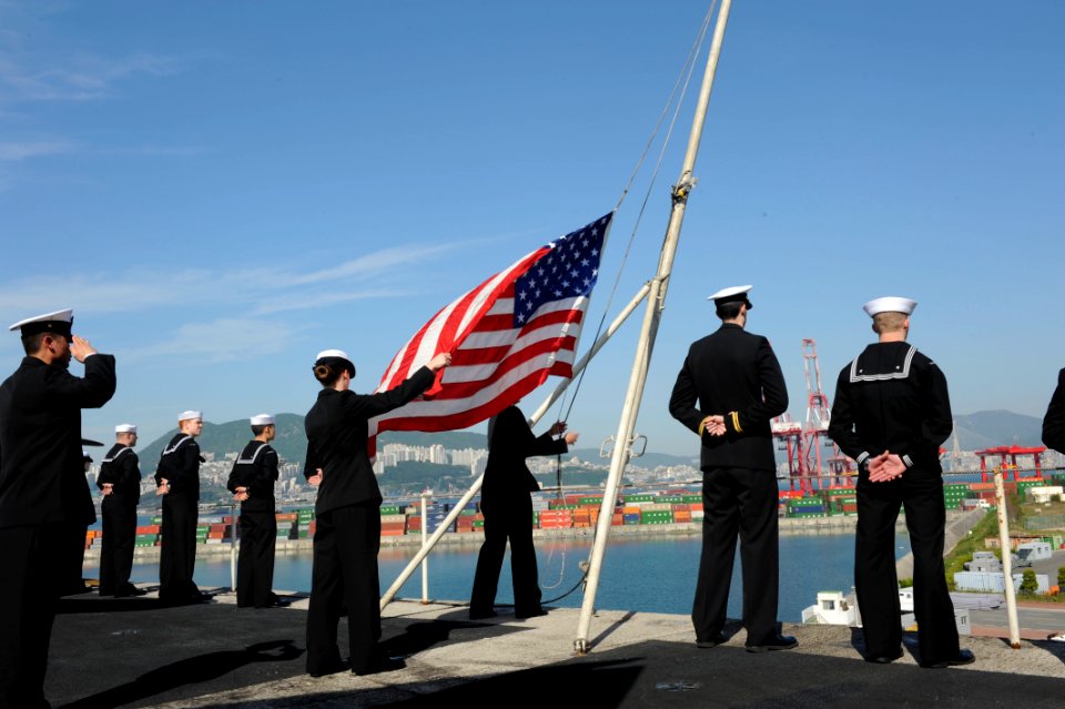 Sailors raise the ensign. (8735657071)