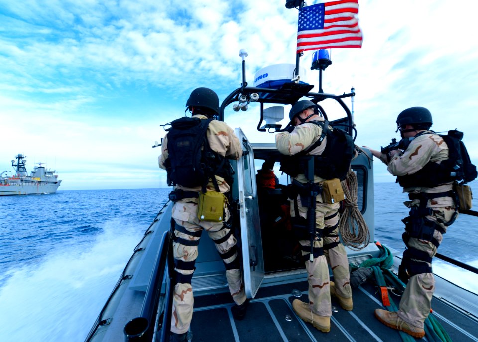 Sailors ride a RHIB for a VBSS exercise. (8467234165)