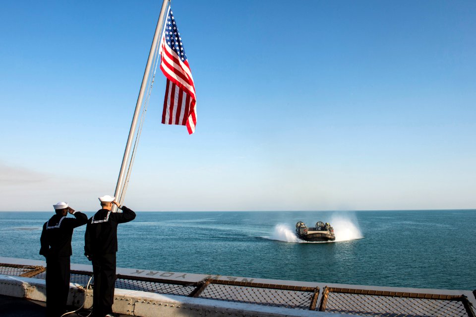 Sailors salute the national ensign during morning colors. (16036619003)