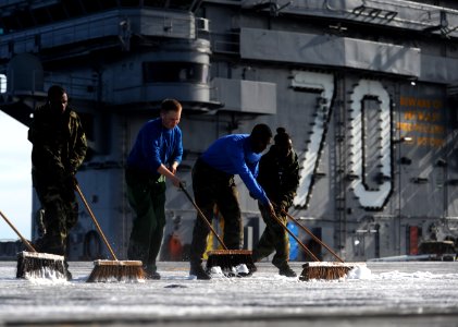 Sailors scrub the flight deck of USS Carl Vinson. (8448065906)
