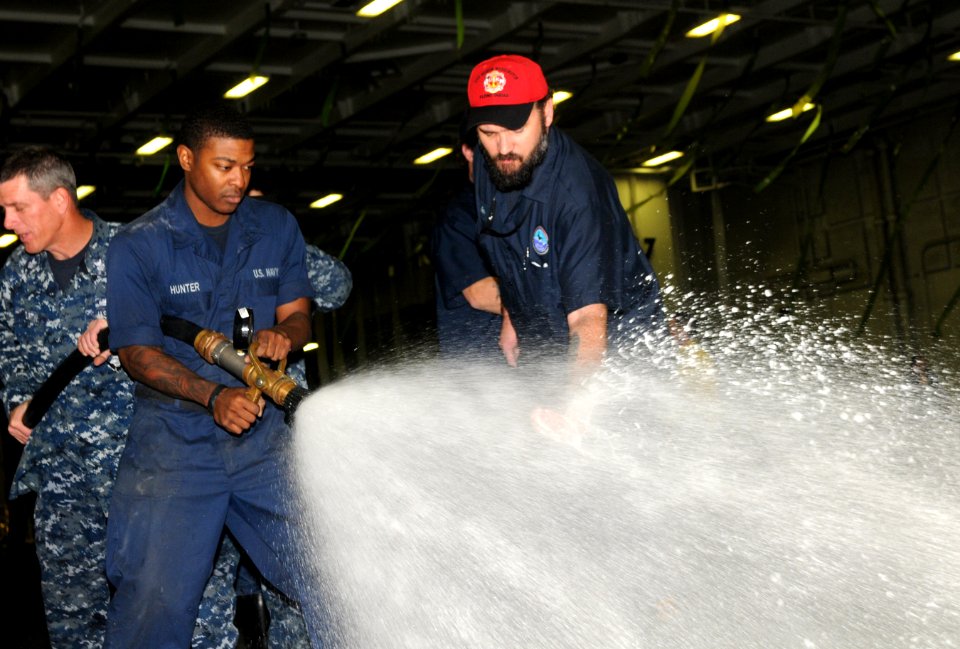 Sailors test AFF in the hangar bay. (8448064346)