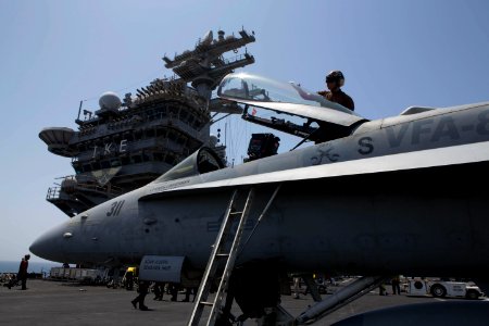 Sailors wipe down an F A-18C Hornet. (8745314450)
