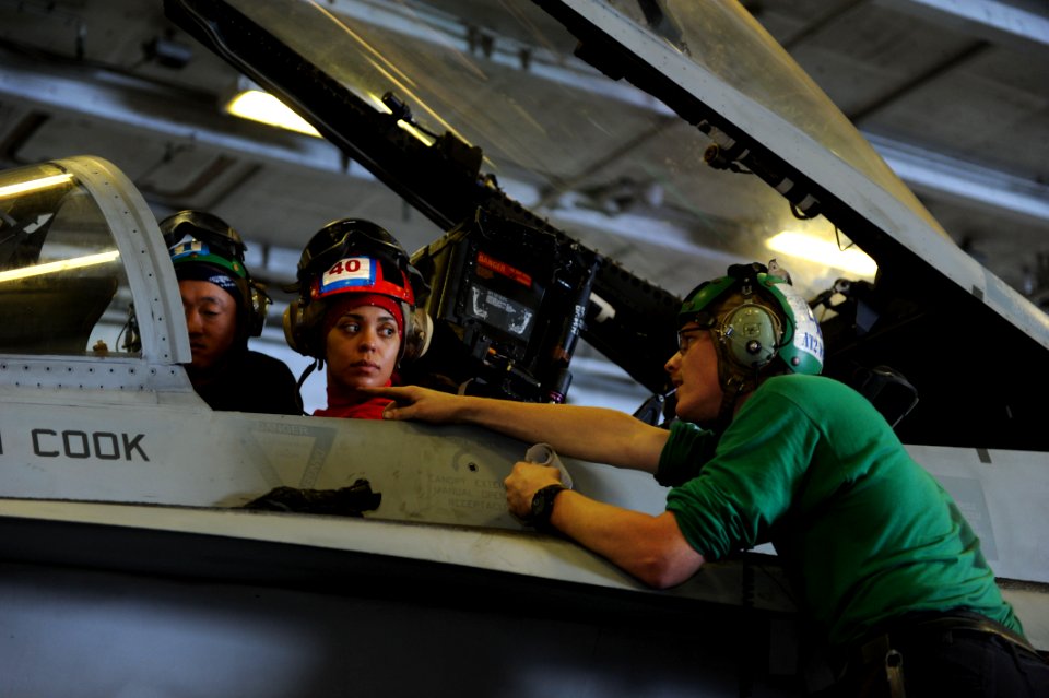 Sailors work on an F A-18 Hornet. (8232067123)