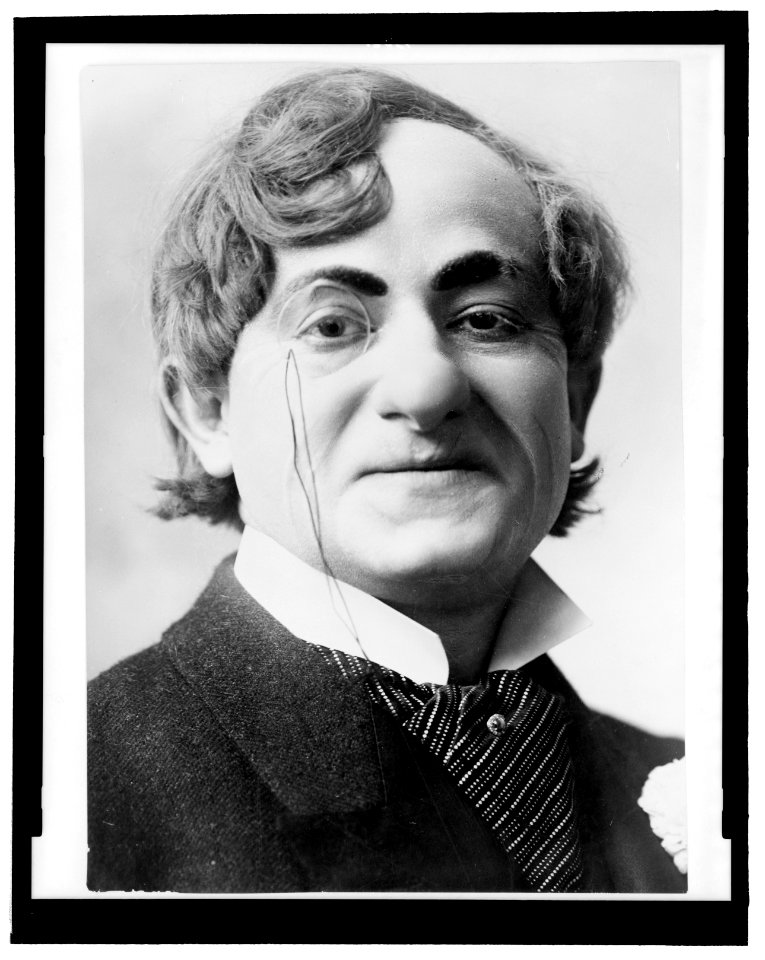 Sam Bernard, head-and-shoulders portrait, facing right, wearing monocle, as Herman Schultz in The girl and the wizard LCCN96503947