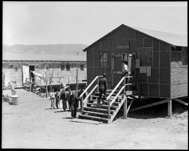 San Bruno, California. Early comers to a mid -day meal. There are eighteen such mess halls which, . . . - NARA - 537921 photo