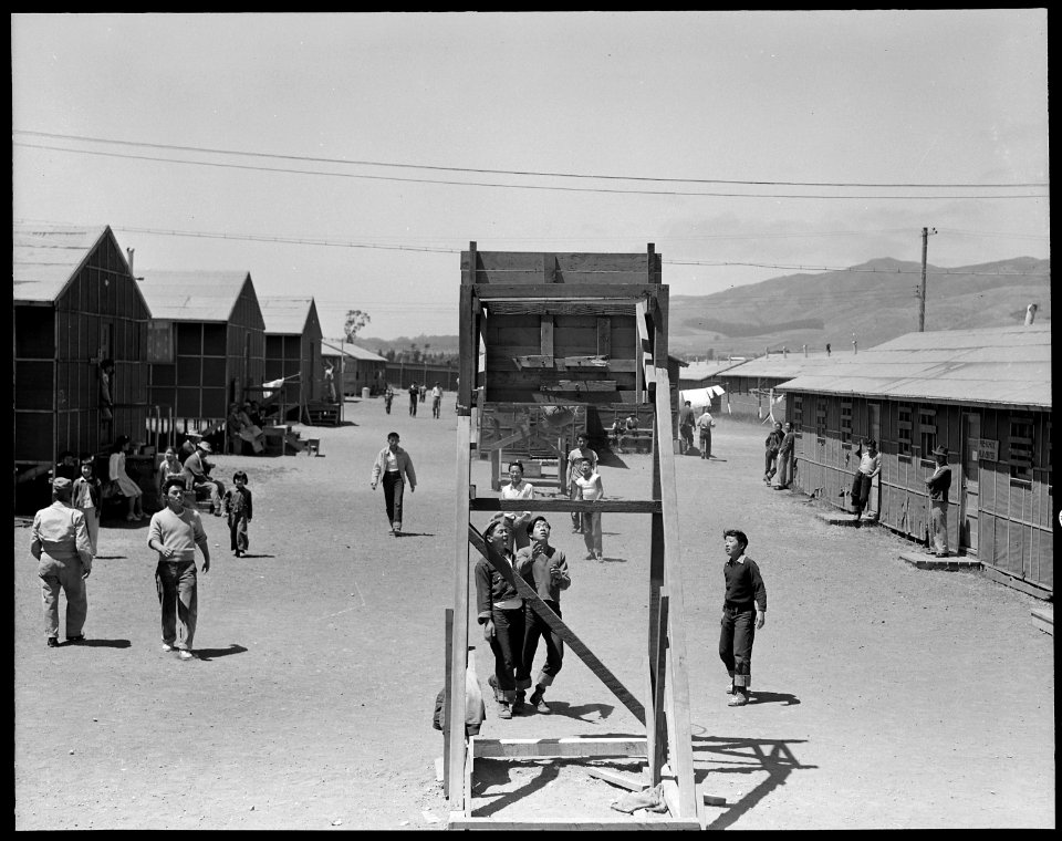 San Bruno, California. Evacuee boys in the foreground are playing basket-ball. This is one of eigh . . . - NARA - 537938