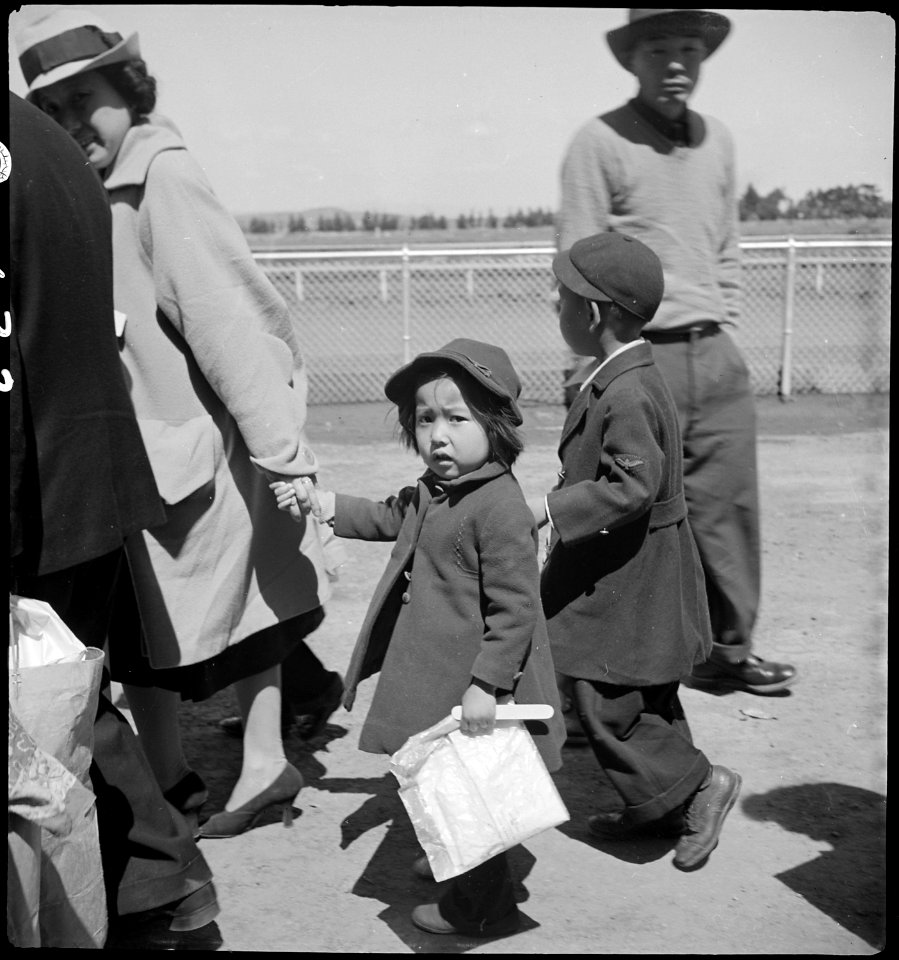 San Bruno, California. Family of Japanese ancestry arrives at assembly center at Tanforan Race Trac . . . - NARA - 537484
