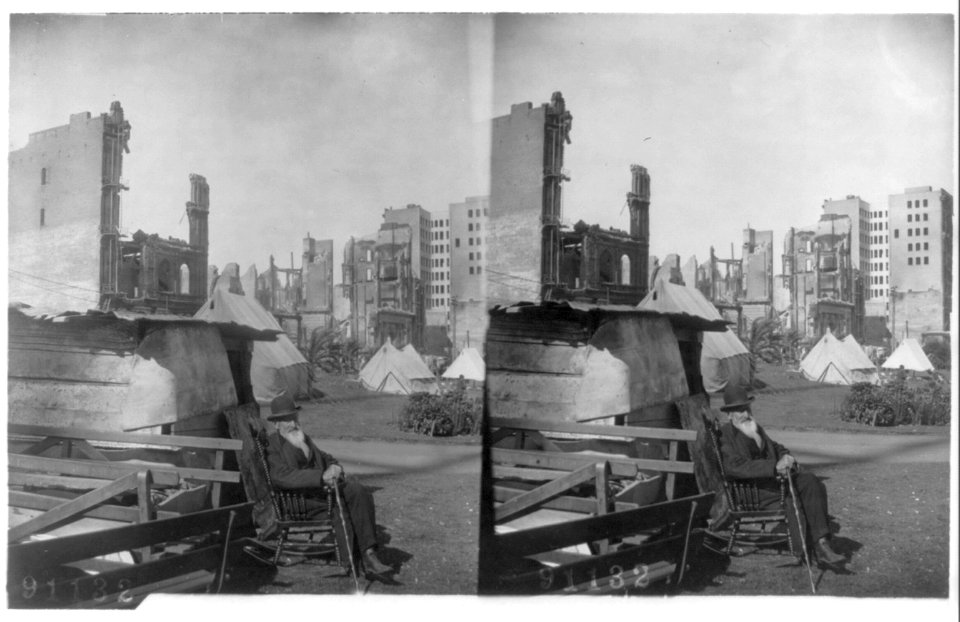 San Francisco earthquake- Aged, bearded man seated in rocking chair in foregrd.; tents; ruins in background. LCCN2002697758
