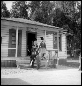 San Bruno, California. Pre-school evacuee children leaving the building for recess at this assembly . . . - NARA - 537895